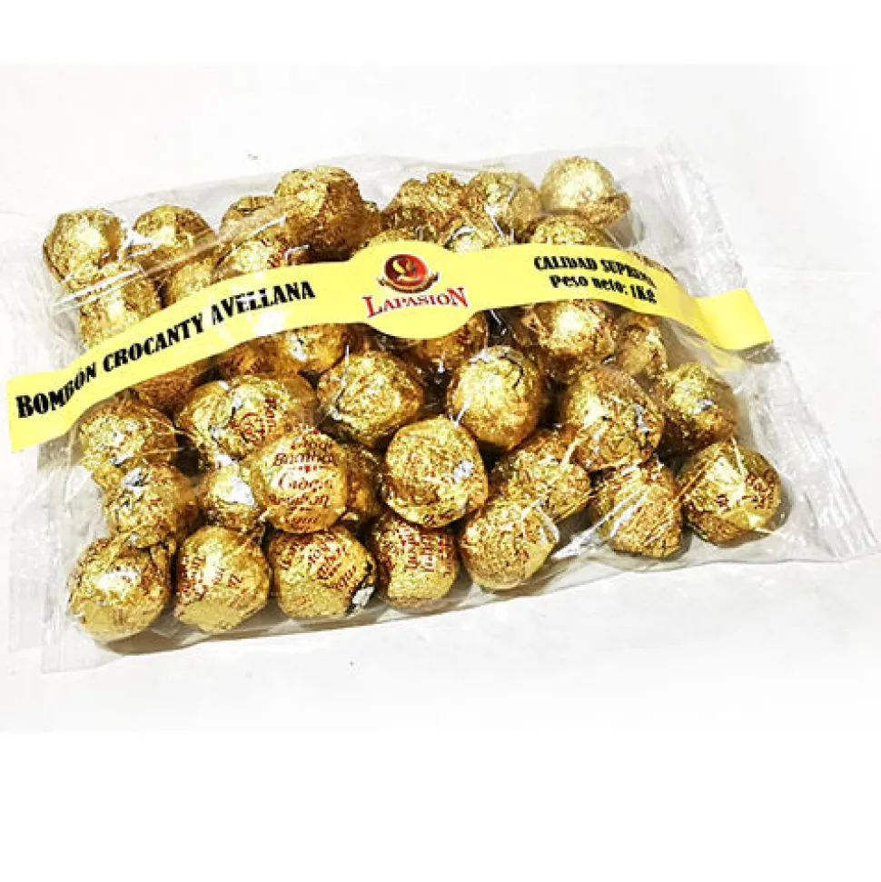 Bombón crocanti relleno de crema de cacao y avellana, cubierta de crocanti de almendra, cobertura de cacao y arroz inflado. Bolsa 1 Kg