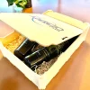 Caja de madera con 2 botellas de Aceite de 500 ml. y vaso de cata de AOVE oficial